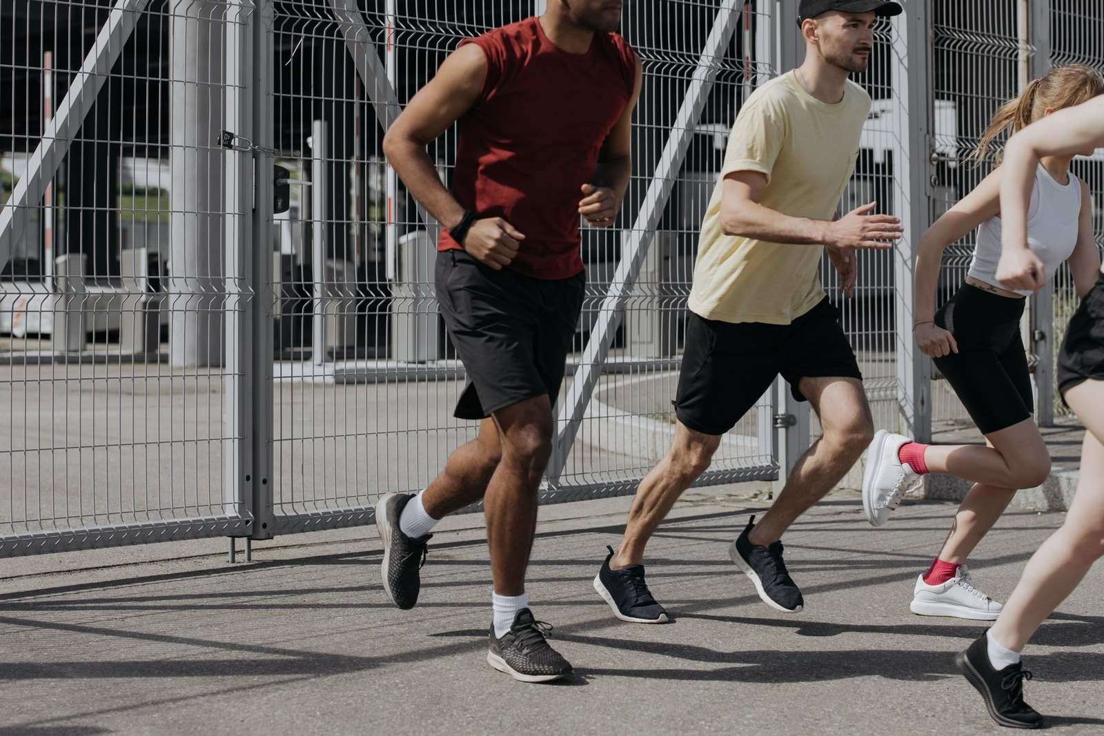 A group of runners moving together during an outdoor community run